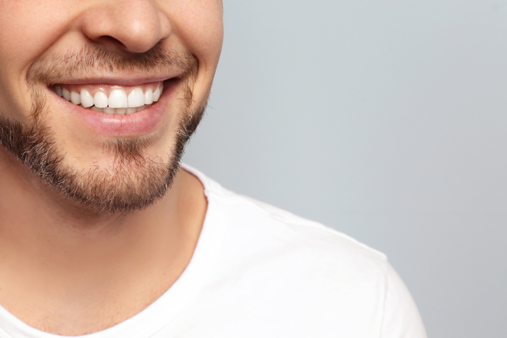 man smiling white teeth cleaning