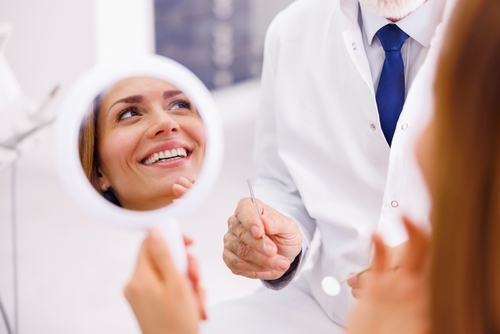 woman looking at her smile