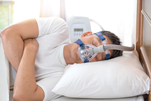 man using a CPAP machine