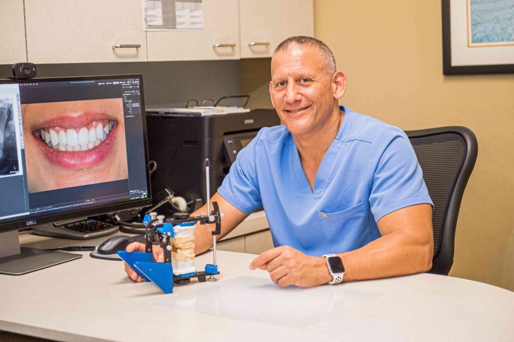 Dr. Nick Addario showing a straight smile after treatment.